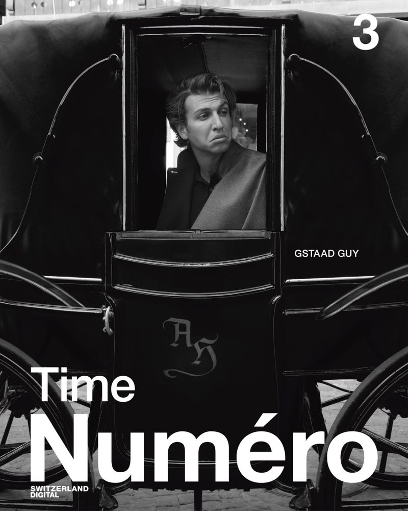 Black and white magazine cover featuring a man inside a carriage, with the magazine's title prominently displayed, and the number 3 at the top.