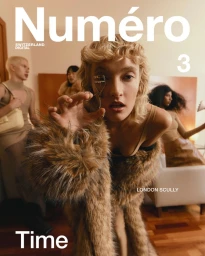 Model London Scully holds an eyelash curler to her eye wearing a shaggy brown faux fur coat for Numéro Switzerland.