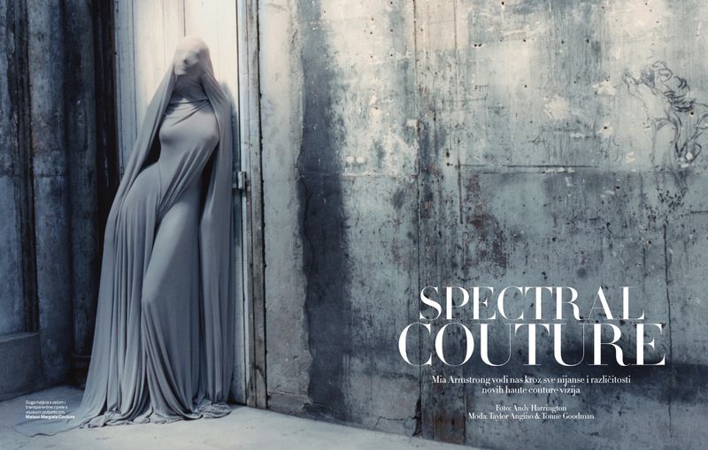Fashion shot of a person draped in a grey, flowing dress standing against a textured wall, creating a ghostly, spectral aesthetic.