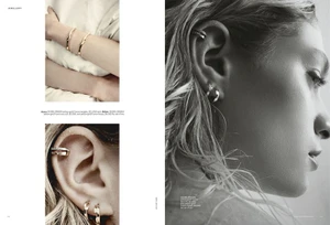 Monochrome magazine editorial layout featuring close-up portraits of a model wearing gold jewellery