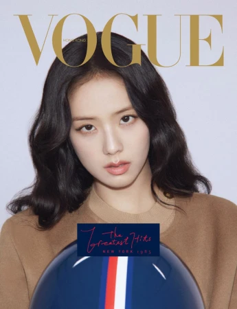 Vogue Hong Kong cover featuring an Asian woman with dark hair, wearing a brown top, holding a dark blue motorcycle helmet.