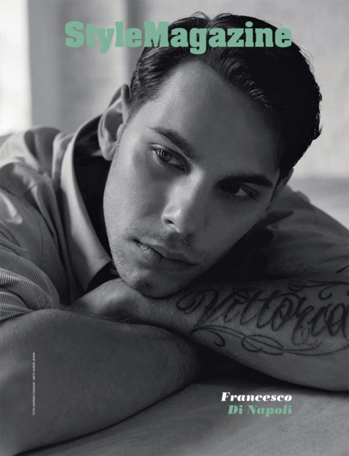 A young man with dark hair poses in a soft light with his arms folded on a magazine cover. The magazine title 'StyleMagazine' is at the top.