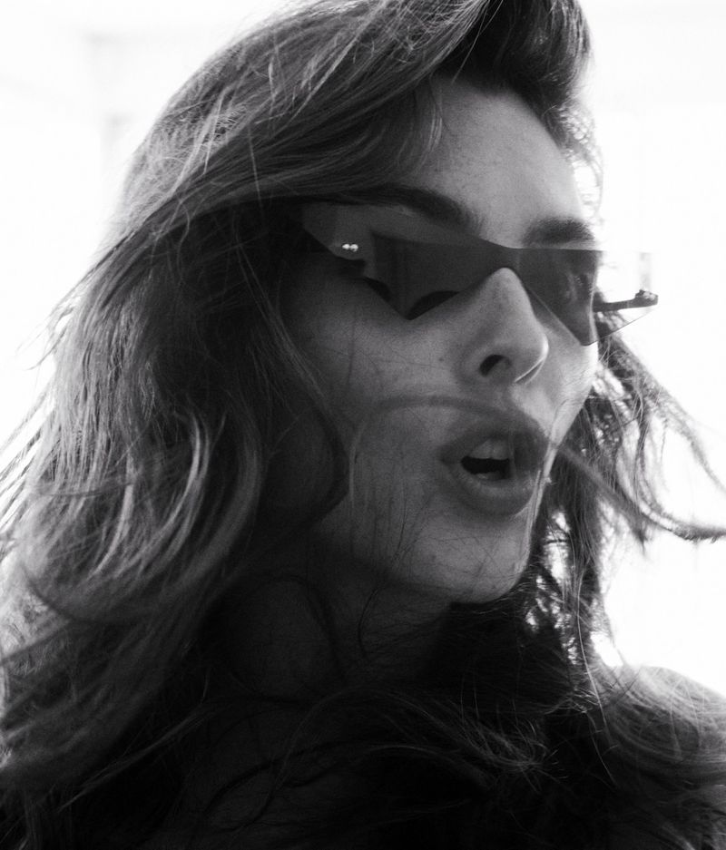 Model Vittoria Ceretti wearing geometric sunglasses in a close-up portrait shot for D Repubblica