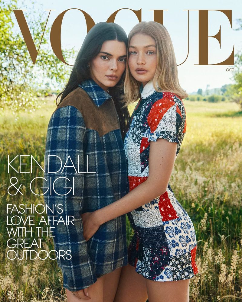 American Vogue cover featuring model Gigi Hadid wearing a long, red Valentino dress, photographed in a studio setting with bright lighting.