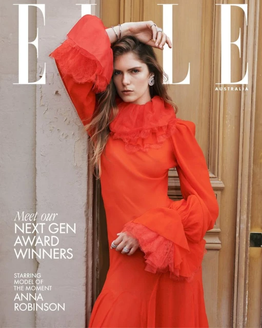 Elle Australia cover featuring Anna Robinson, model of the moment, in a red dress with frilled collar, posing against a beige wall.