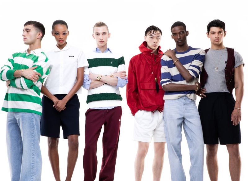 Six diverse fashion models in a studio setting showcase preppy apparel with polo shirts, shorts, and pants against a bright white background.