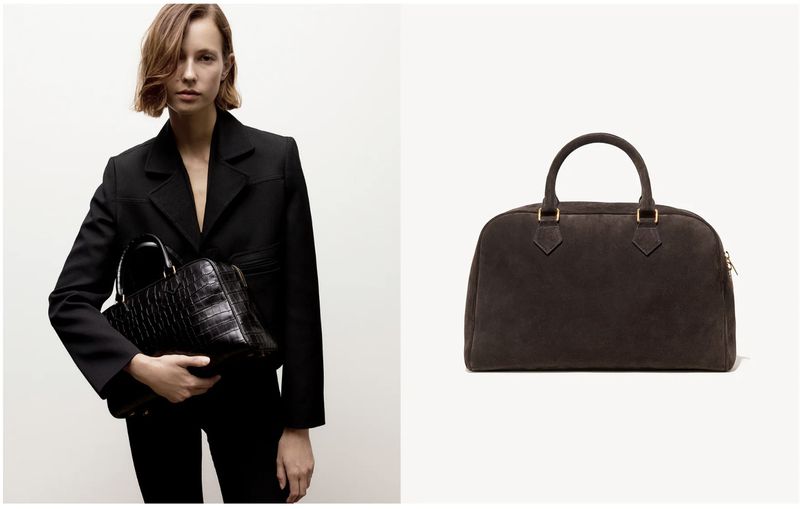 Woman wearing a black blazer and holding a crocodile embossed leather satchel bag, next to a brown suede satchel bag against a white background.