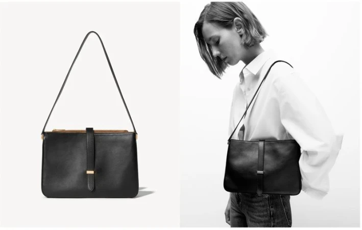 Black leather shoulder bag displayed next to model Mali Koopman wearing a white shirt and carrying the bag against a white backdrop.