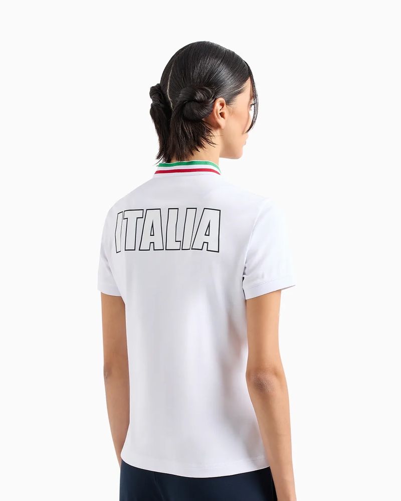 Woman wearing a white shirt with 'ITALIA' printed on the back, viewed from the rear against a clean, bright white background.