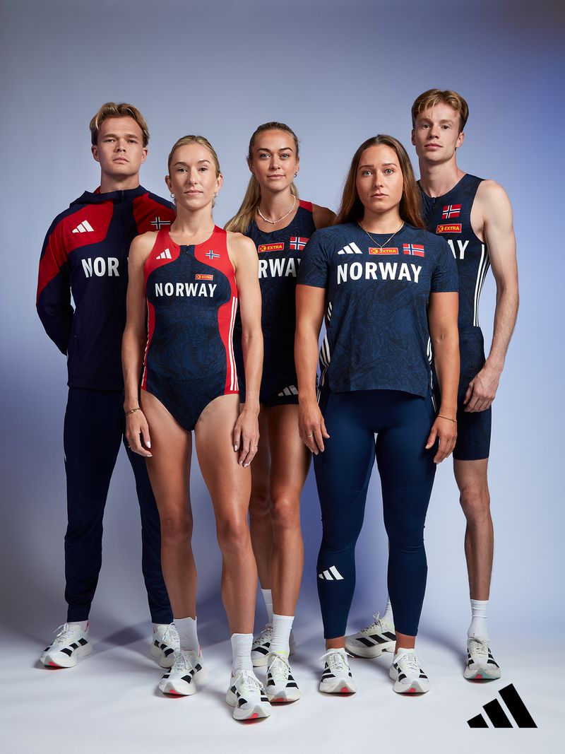 Group of five athletes in Norway team uniforms, posing indoors. They wear Adidas shoes and apparel with the Norwegian flag.