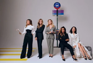 Group of five prominent actresses including Jennifer Aniston and Reese Witherspoon posing by a bus stop sign in a studio