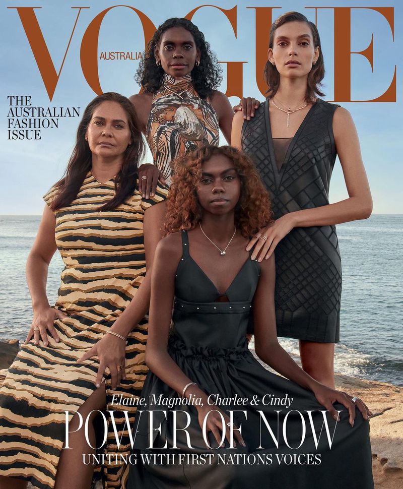 Vogue Australia cover features four Indigenous Australian models: Elaine, Magnolia, Charlee & Cindy wearing contemporary fashion by the ocean.