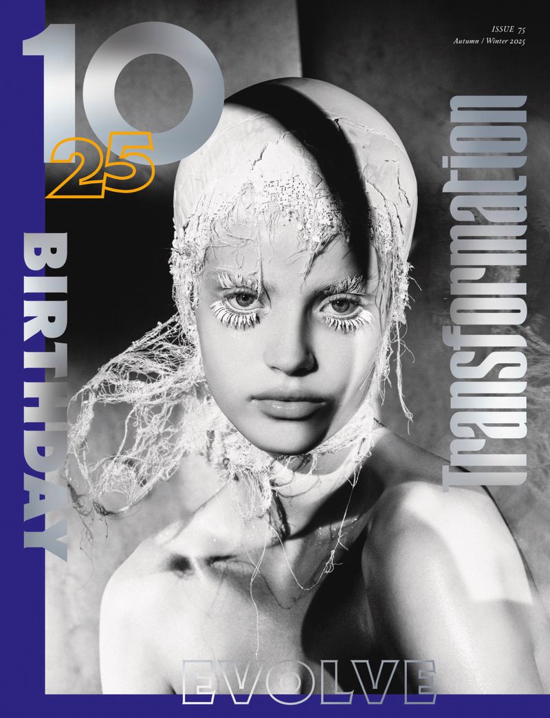 Monochrome fashion magazine cover featuring a striking portrait of a woman with textured white hair and stark white eyelashes.