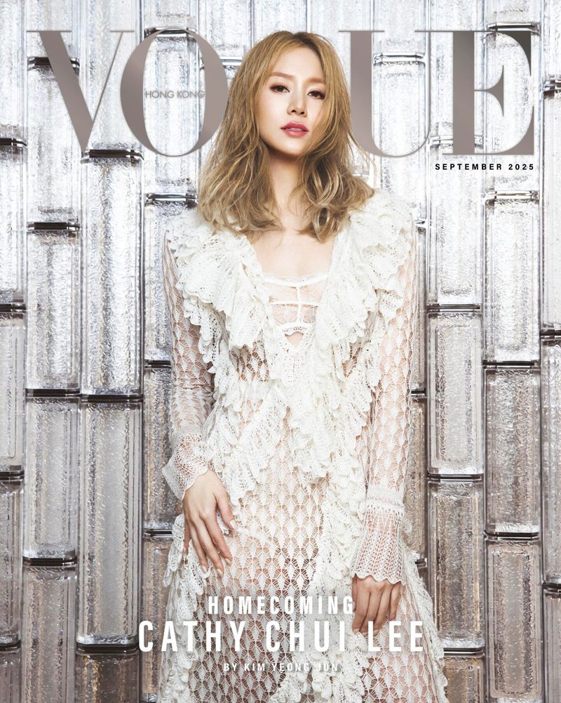 Vogue Hong Kong cover featuring a woman in a lacy white dress, captured in a studio setting against a metallic textured background.