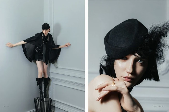 Model in black cape and boots standing on wire bin with headshot inset for Elle Hungary