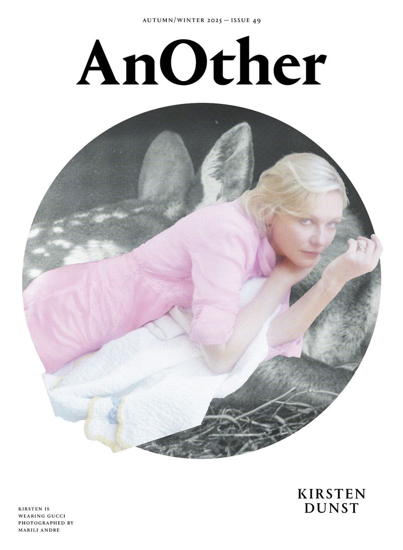Magazine cover featuring Kirsten Dunst wearing Gucci, photographed by Marili Andre, resting with a deer in a monochrome scene.