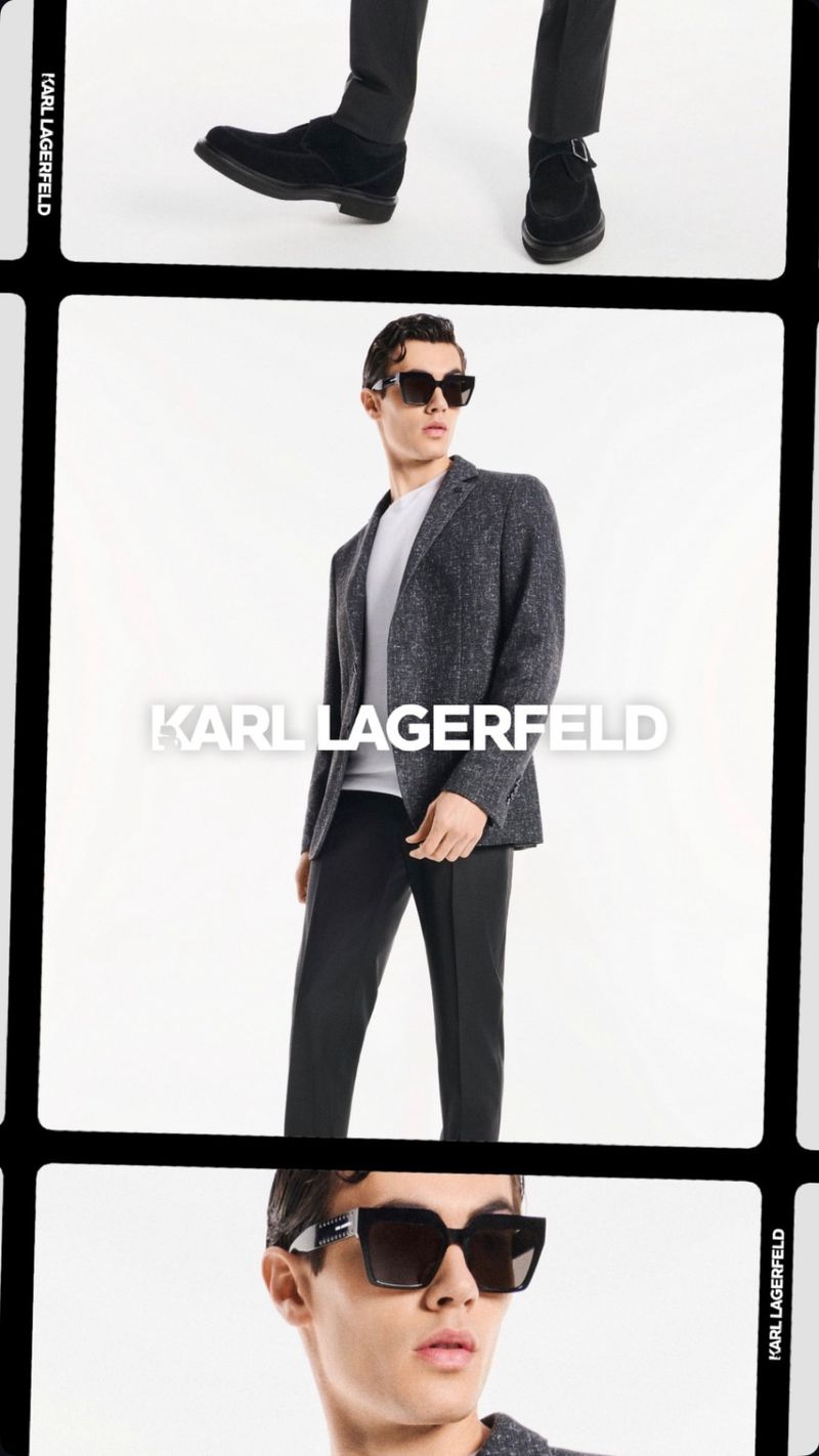 Fashionable adult male model in a blazer and sunglasses poses in a bright photo studio for Karl Lagerfeld menswear advertisement.