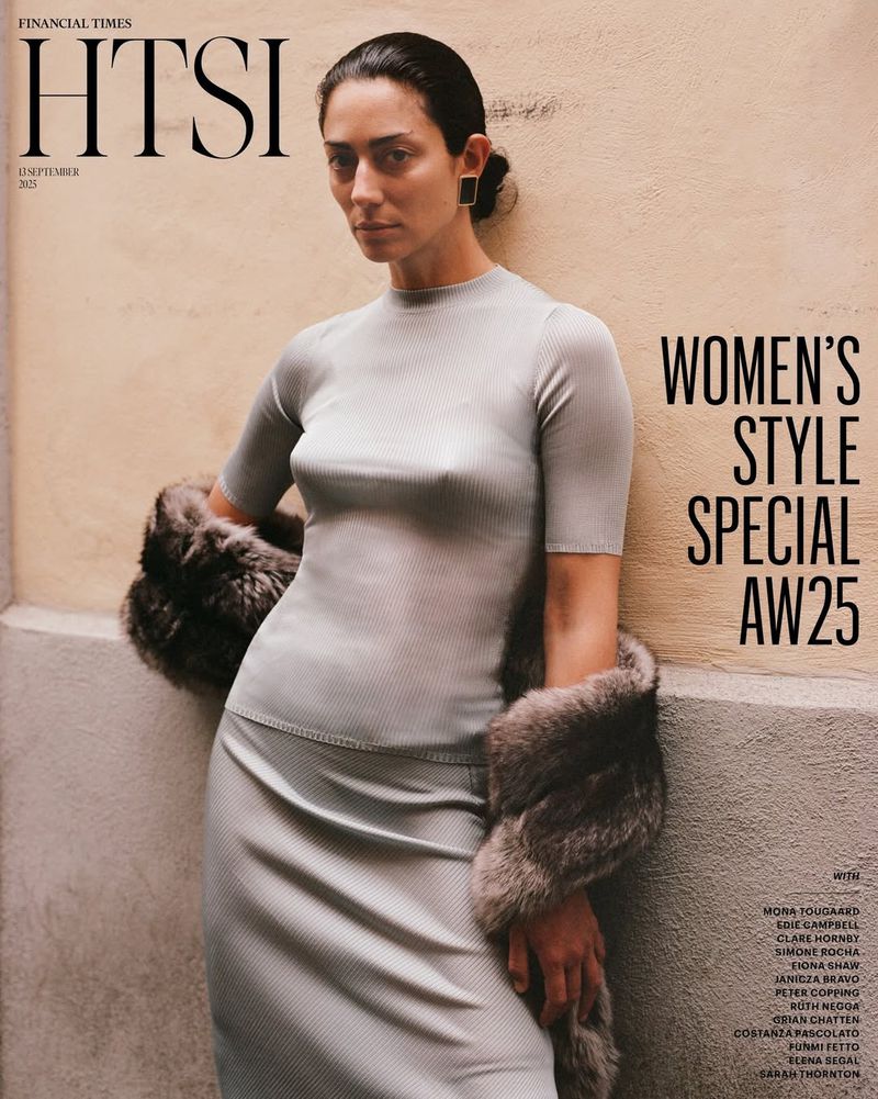 Magazine cover featuring a woman in a grey ribbed skirt and top, draped with a fur stole, alongside the masthead and text elements.