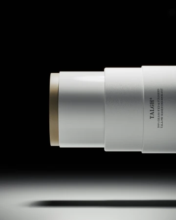 Tallow-based deodorant stick by TALGH in a white container on a gradient white to black background. Beauty and personal care product.