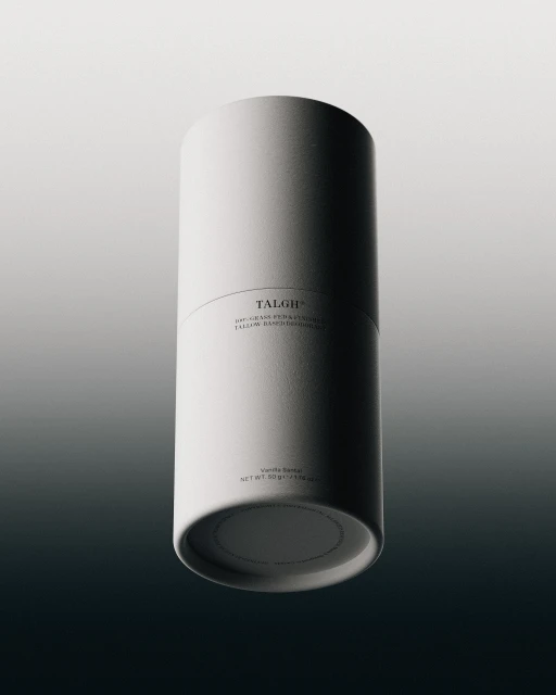 Minimalist studio shot of a white cylindrical container with subtle branding, showcasing clean lines and a gradient background.