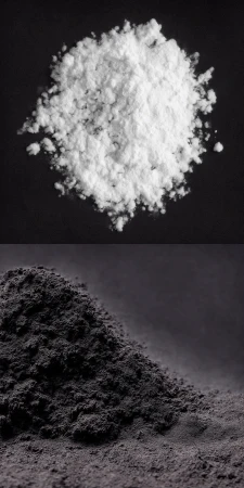 High-angle shot featuring a divided composition of white powder against a black background, contrasted with gray powder on a dark gray surface.