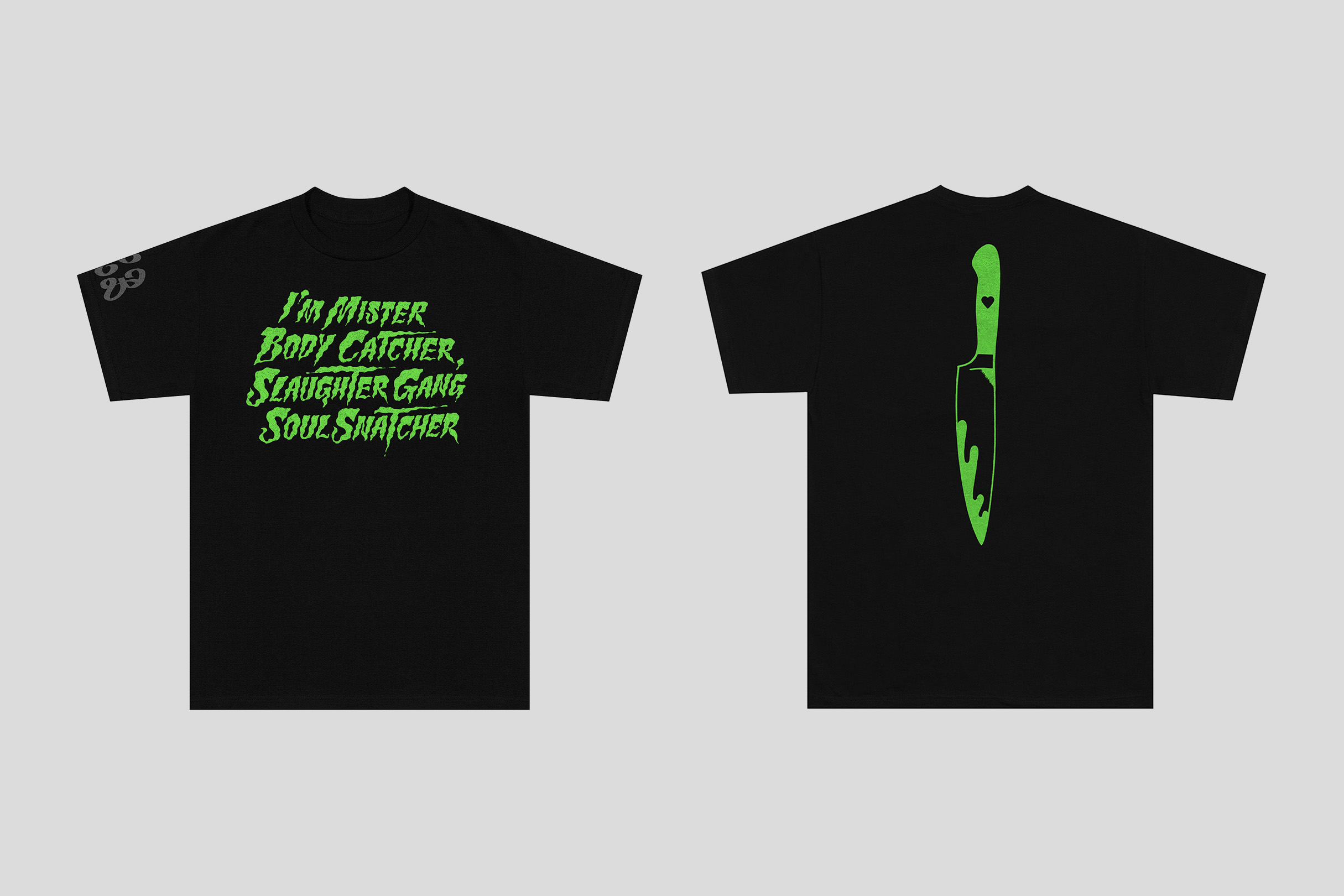Two black t-shirts are displayed on a gray background. One t-shirt has green text, the other has a green knife graphic.