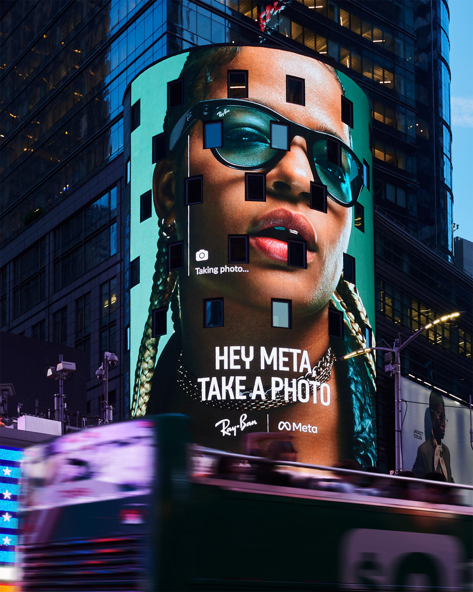 Billboard in Times Square features a close-up of a person wearing sunglasses, promoting Ray-Ban and Meta collaboration, city backdrop.