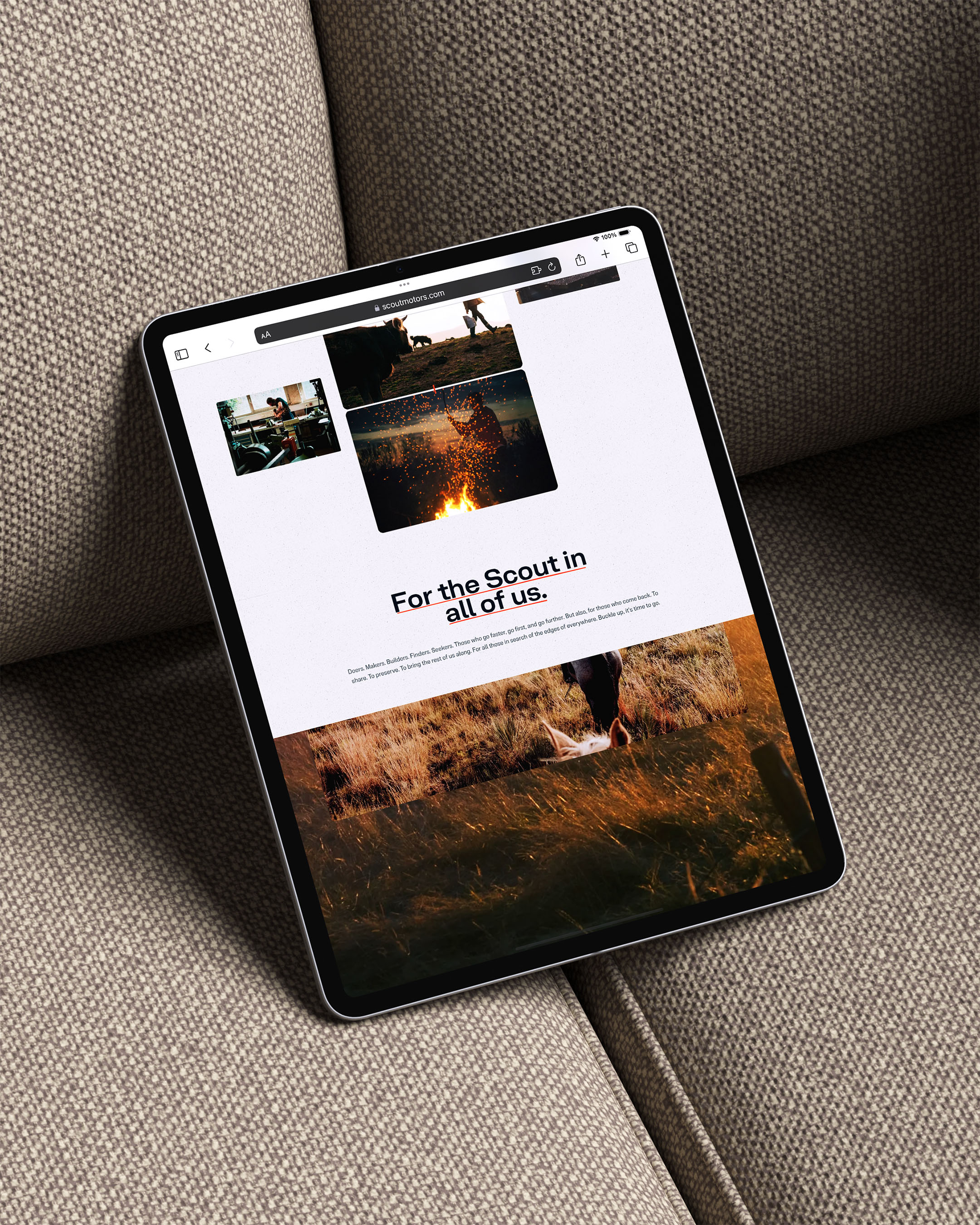Tablet displaying website design with outdoor and nature images, promoting scouting, set against a neutral sofa backdrop.