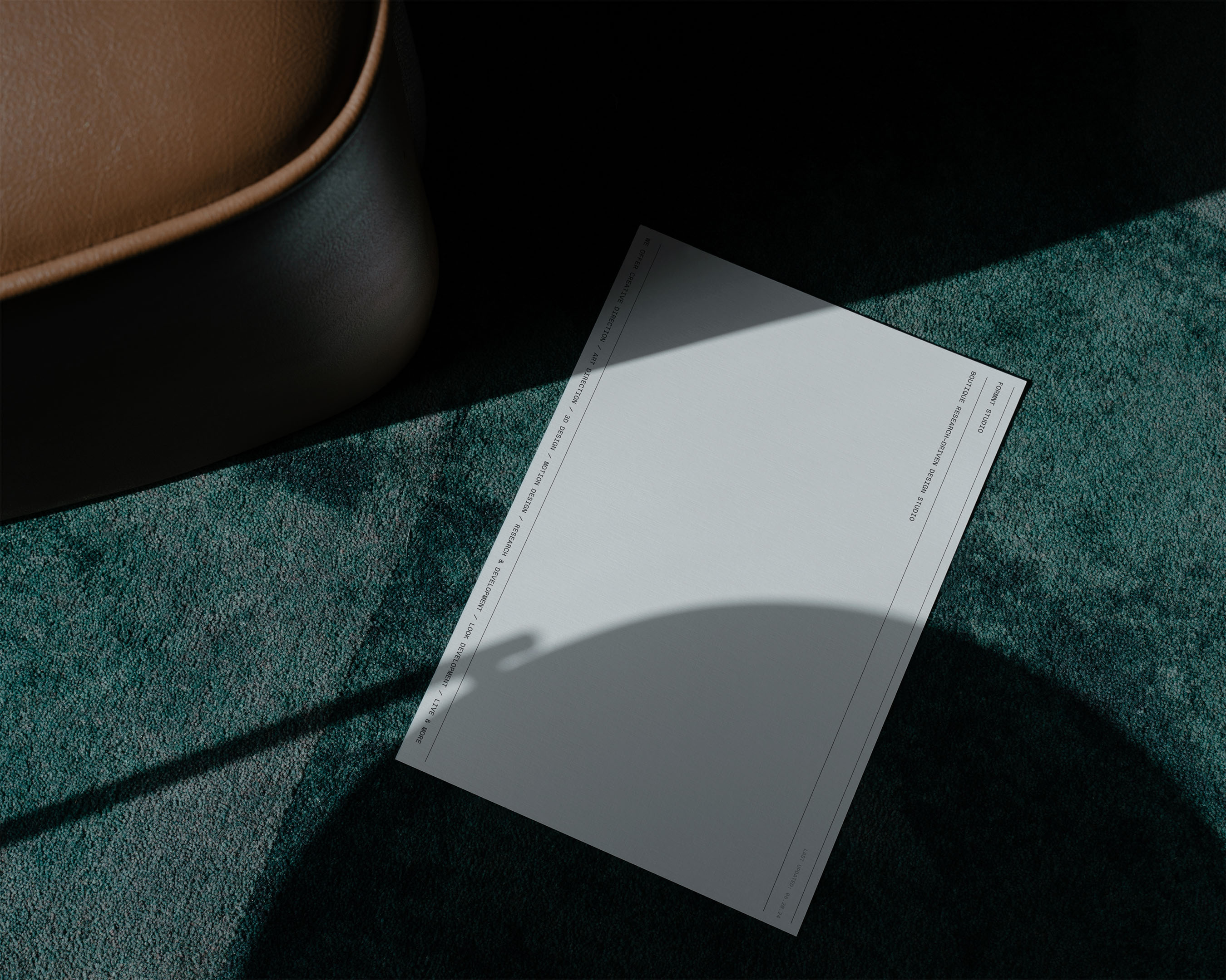 A rectangular sheet featuring the terms 'TOMMY DUNCAN' and 'MICHAEL ABRAHAM CREATIVE DESIGN ADVISOR, DIRECTOR' against a textured green fabric.