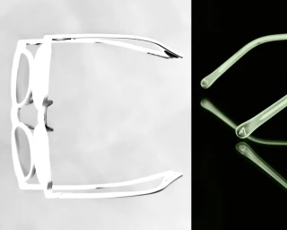 Split view of eyeglasses frames in high-key exposure beside a close-up of translucent temple tips on a reflective dark surface.