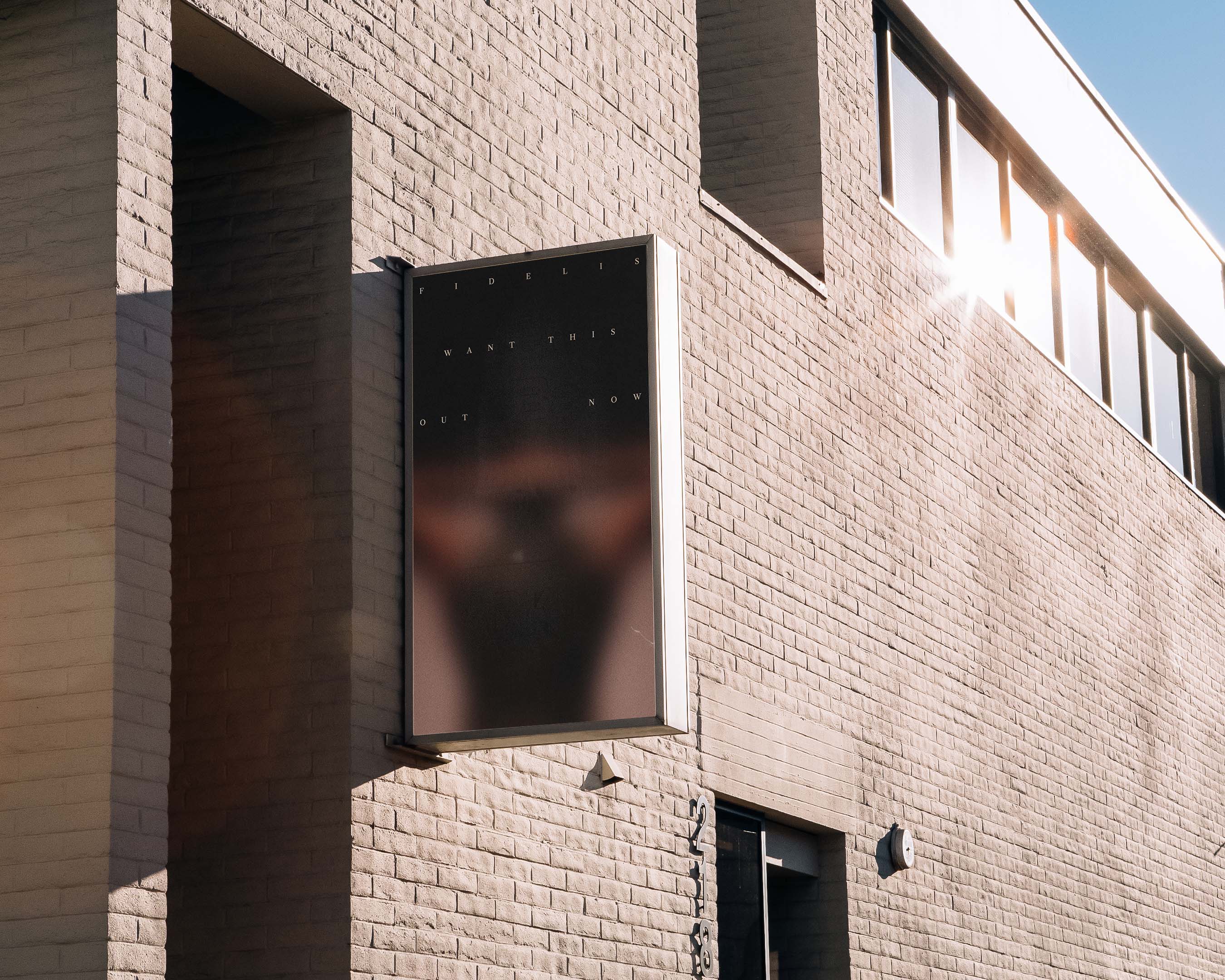 Outdoor image features a promotional poster on a brick building exterior, advertising “Firefly” with the words “Want this get now”.