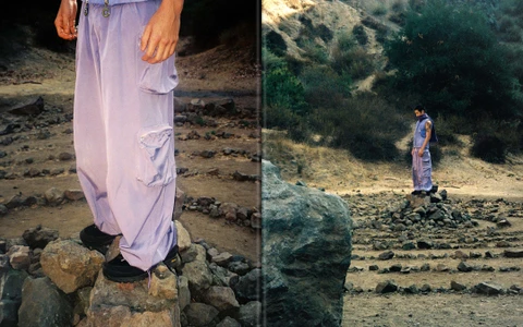 Diptych fashion campaign photograph of a model in lavender cargo pants and black shoes standing on rocks in a rugged dry terrain.