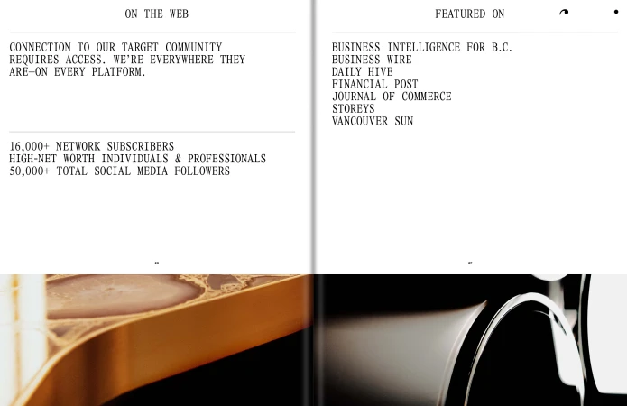 Close-up of an open magazine spread with text and abstract design elements on each page, capturing a modern, minimalist aesthetic.