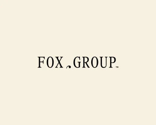 Black serif typography reading FOX GROUP centered on a pale cream background for visual identity design.