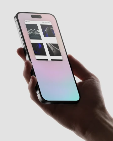 Close-up of a person holding a smartphone with four pictures displayed on the screen, set against a bright background showcasing mobile technology.