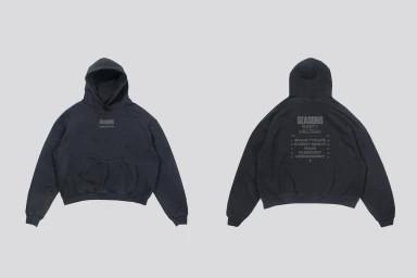 Front and back view of a washed black pullover hoodie from the Kelland SEASONS EP campaign on a light grey background.