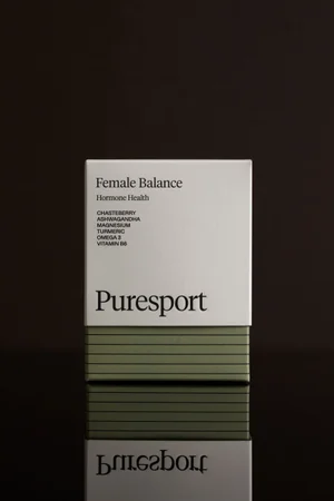 Puresport Female Balance supplement packaging box standing on a reflective dark surface.