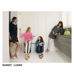 Four female models posing in a minimalist white interior space for Sandy Liang F/W 2025 fashion collection editorial image