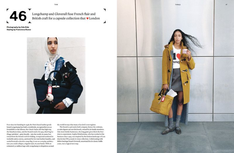 Fashion editorial featuring a slender woman in a yellow duffle coat and a tote bag standing against a gray wall, accompanied by magazine text.