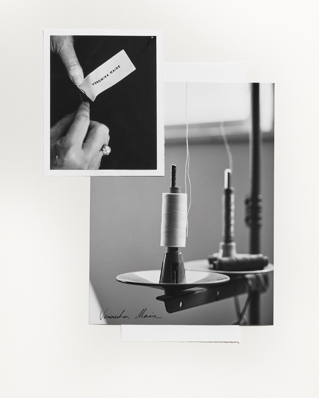 Black and white photograph featuring a spool of thread and a hand holding a tag in a minimalist studio setting, classic and refined.