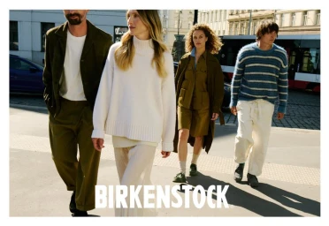 Group of four models walking on a sunny city street for the Birkenstock Utti Lace campaign