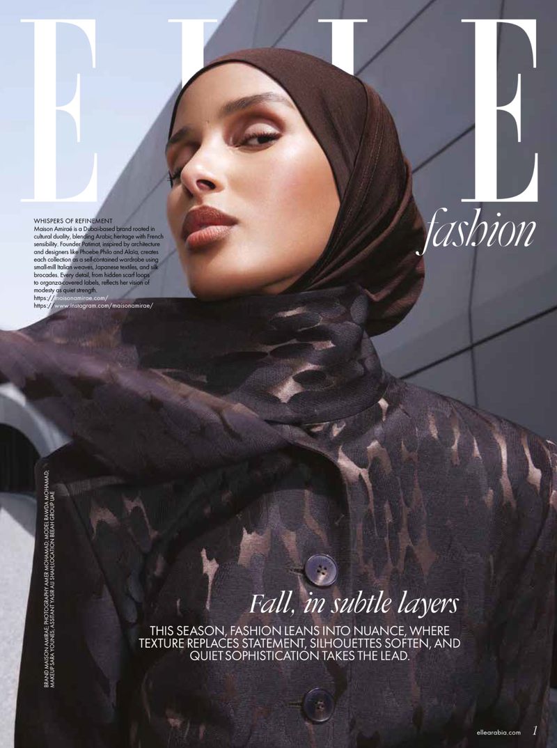 Elle fashion magazine cover featuring an adult female model wearing a brown hijab and jacket with subtle camouflage-like pattern.