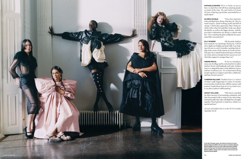 A group of five fashion models in dramatic couture pose together indoors with editorial lighting, showcasing avant-garde clothing designs.