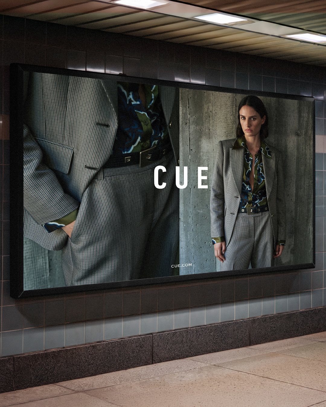 Fashion advertisement featuring a woman in a gray suit, posing against a concrete wall, next to a close-up of a matching gray suit.