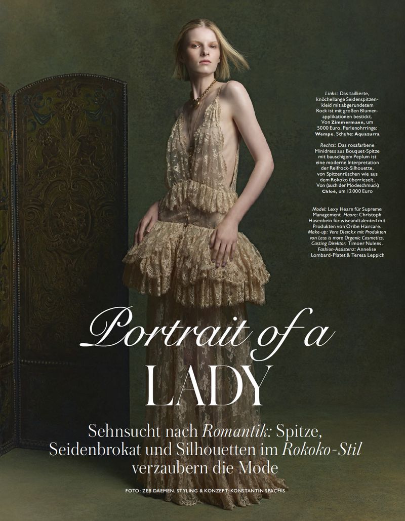 A slender woman poses in a flowing gold gown, a modern take on Rococo style, complemented by an olive-green background and a decorative folding screen.