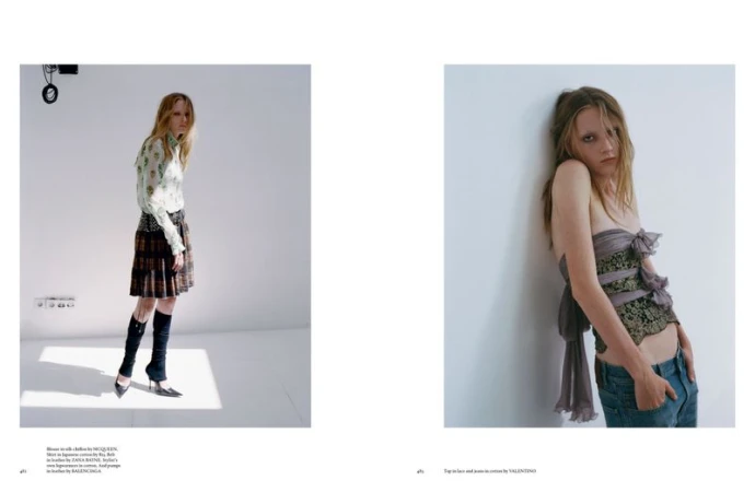 Fashion editorial shot: Two slender women in designer outfits against a plain white backdrop, showcasing contrasting styles and poses.