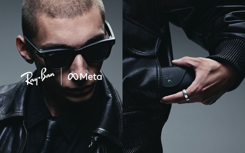 Man in Ray-Ban Meta smart glasses with a leather jacket. Sunglasses and Ray-Ban Meta logo is visible in front of gray background.