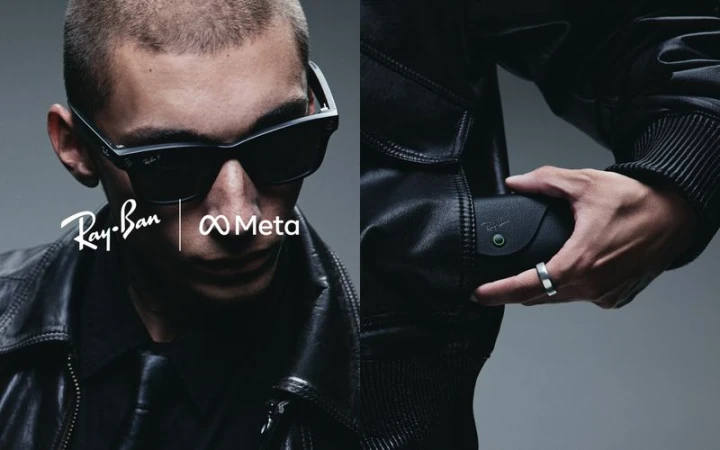 Man in Ray-Ban Meta smart glasses with a leather jacket. Sunglasses and Ray-Ban Meta logo is visible in front of gray background.