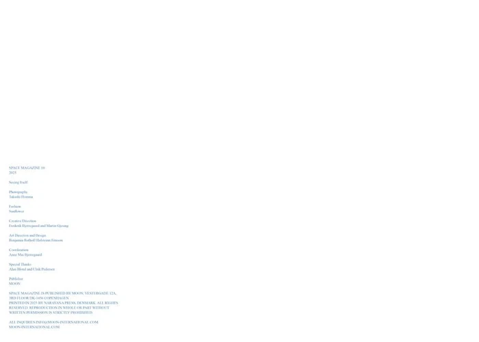 Minimalist white magazine page layout with small blue-grey editorial credits and publishing text aligned in the lower left corner.