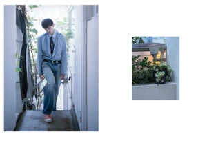 Young man in a blue striped shirt, tie, and denim jeans walking down an outdoor stairwell alongside a potted plant inset image.